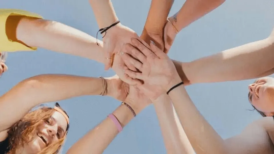 Hands stacked together